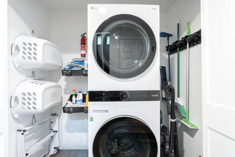 A stacked washer and dryer I Lower Level