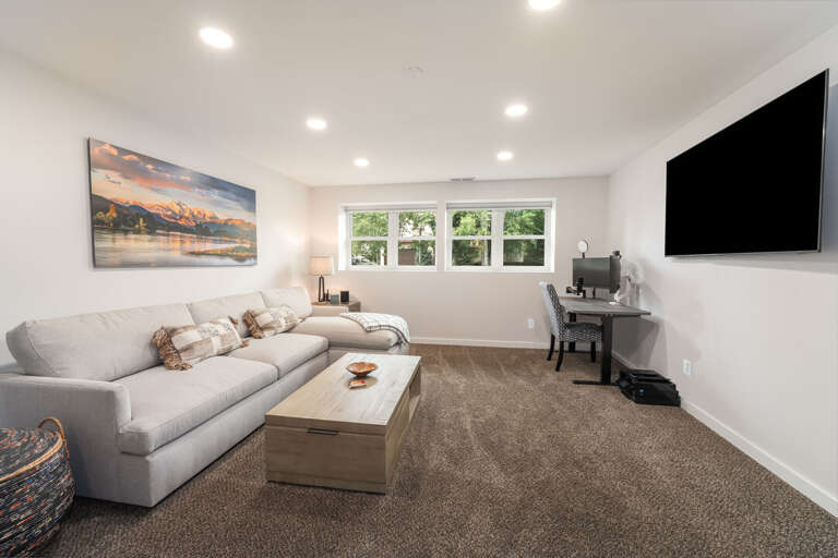 A second TV and cozy sectional for movie marathons I Lower Level
