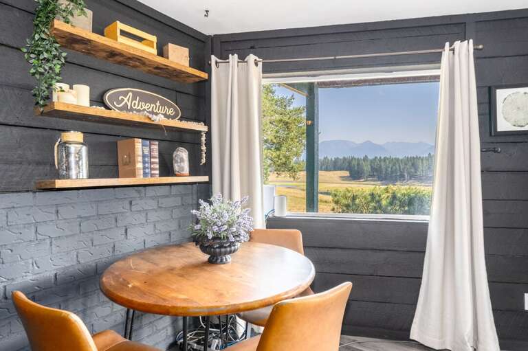 Basement dining area with mountain views.