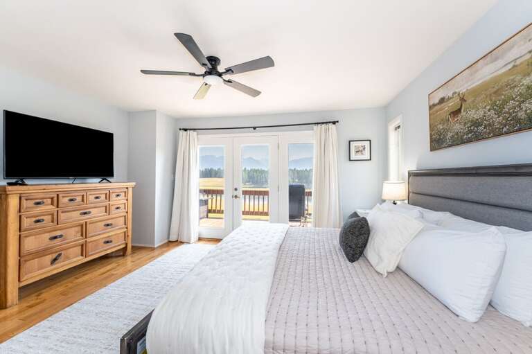 Primary bedroom with deck access.