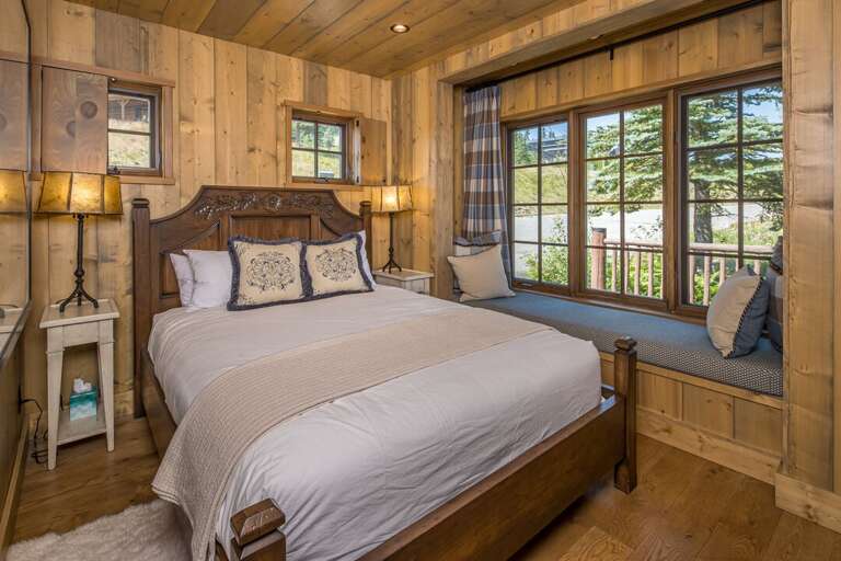Cozy wood bedroom with window nook | Main Level