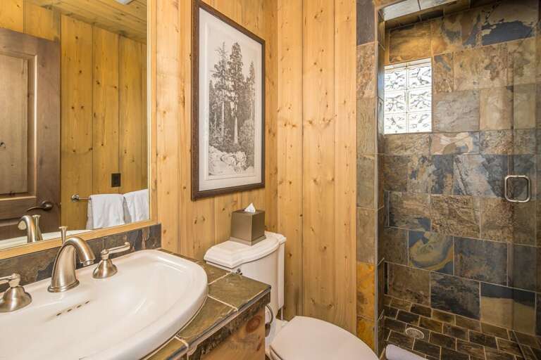 Rustic bathroom with slate tile walk-in shower | Main Level