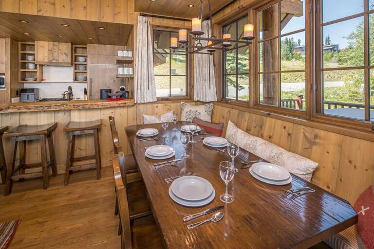 Rustic dining nook with mountain views and chandelier | Main Level