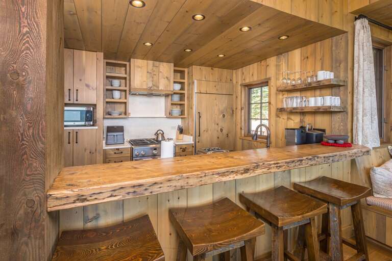 Rustic kitchen with live edge bar | Main Level