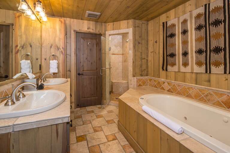 Spacious master bath with double sinks, soaking tub and walk-in shower | Main Level