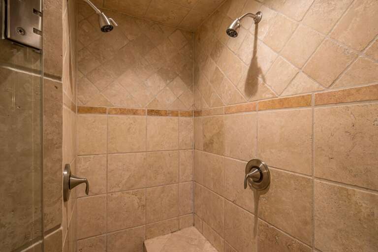 Travertine double shower head walk-in shower | Main Level