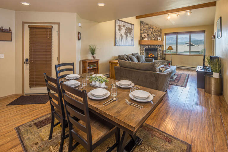 Dining and living area with fireplace | Main Level
