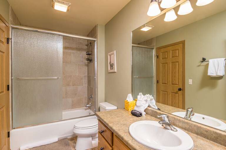 Glass shower door shower tub combo | Main Level