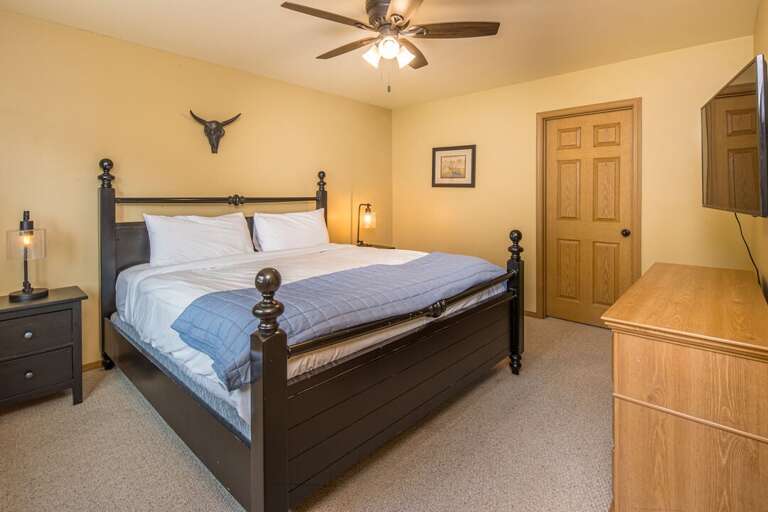 King bedroom with western longhorn decor | Main Level
