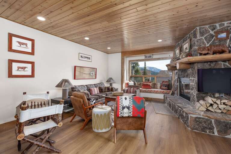Pull a chair up to the floor to ceiling stone fireplace and swap stories from the day.