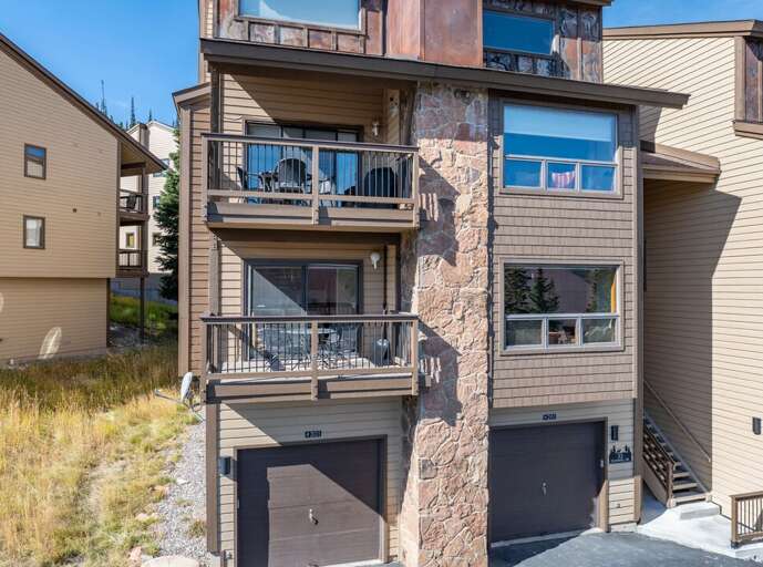 Your mountain home base sits in a quiet Mountain Village complex surrounded by pines.
