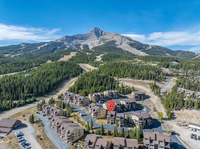 Big Sky Mountain Village sits at your feet with Lone Peak rising right above the neighborhood.