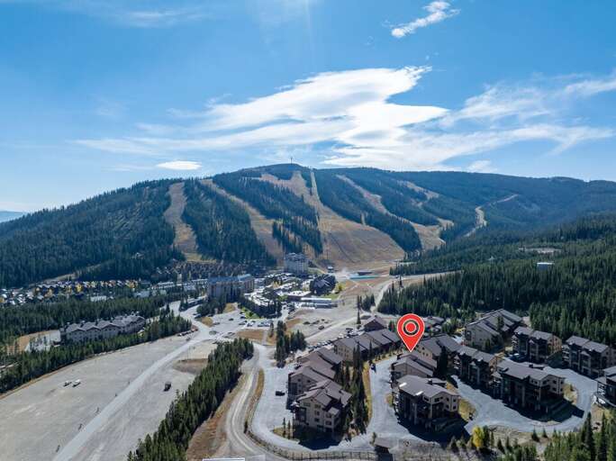 Big Sky Resort's ski runs line the mountain just beyond the neighborhood.