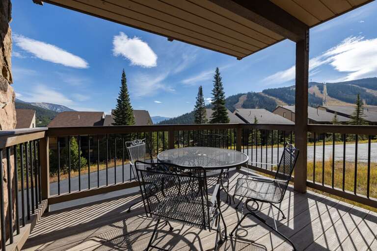 Grab a seat at the deck table and take in the peaks and pines before heading out.