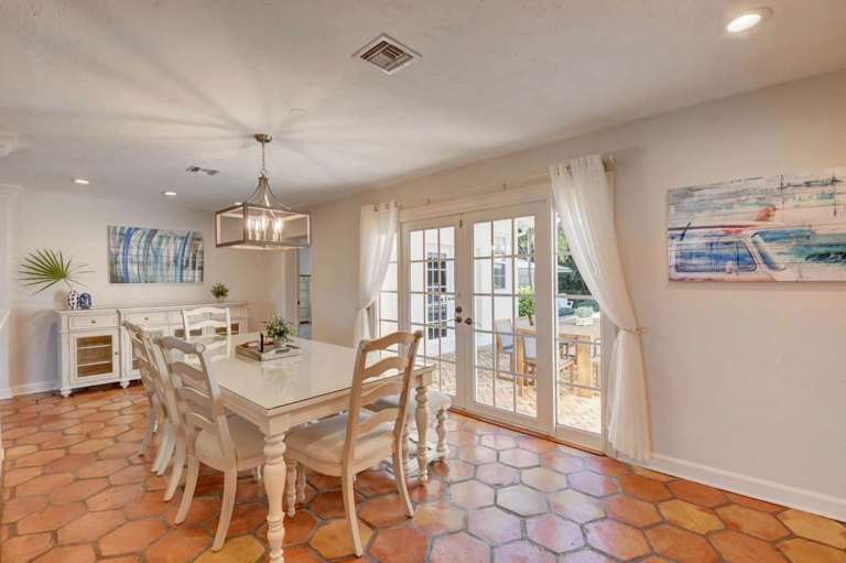 Interior Dining Area With Table, Chairs, And Terracotta Flooring Interior Dining Area With Table, Chairs, And Terracotta Flooring