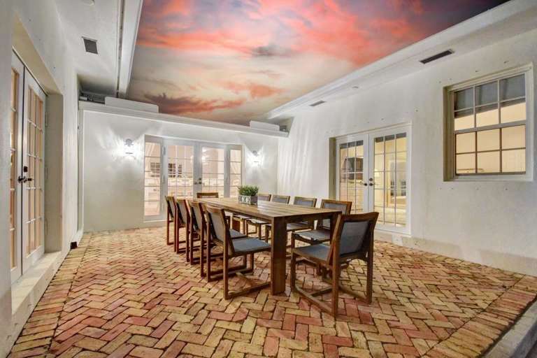 Dining Area With Brick Floor And Sunset Ceiling Mural Dining Area With Brick Floor And Sunset Ceiling Mural