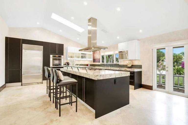 Spacious Kitchen With Island And Bar Stools Spacious Kitchen With Island And Bar Stools
