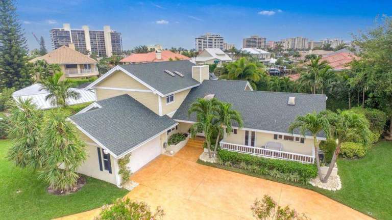 Suburban House With Driveway And Surrounding Buildings Aerial View Suburban House With Driveway And Surrounding Buildings Aerial View