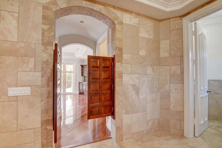 Interior Hallway With Open Wooden Door And Tiled Walls Interior Hallway With Open Wooden Door And Tiled Walls