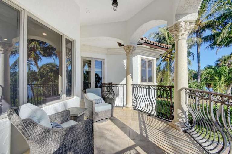 Balcony With Chairs Overlooking Palm Trees Balcony With Chairs Overlooking Palm Trees