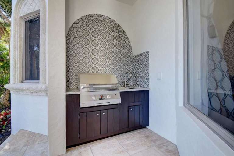 Outdoor Kitchenette With Grill And Patterned Backsplash Outdoor Kitchenette With Grill And Patterned Backsplash