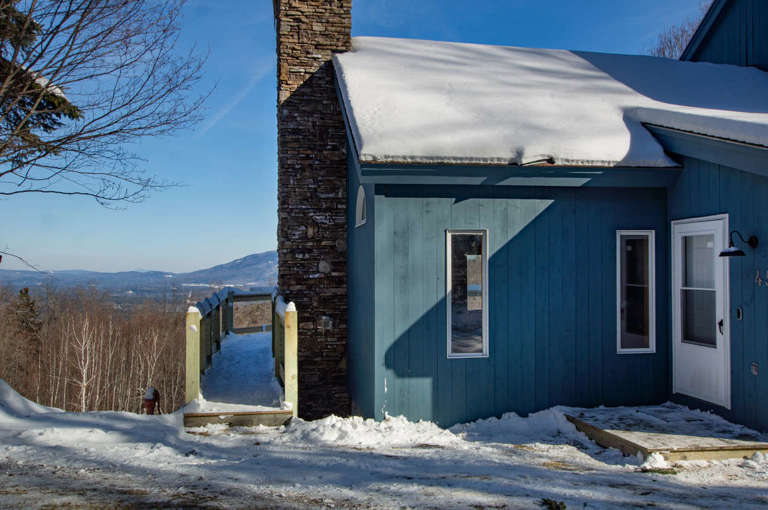 Blue House With Snowy Roof And Mountain View Blue House With Snowy Roof And Mountain View