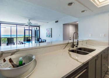 Gorgeous newly renovated kitchen featuring new countertops, appliances and coastal chic design!