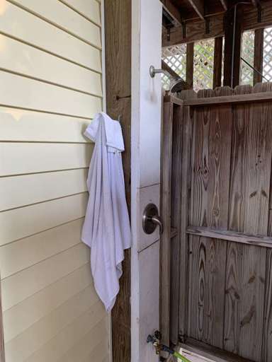 Ground level outdoor shower to wash the sand away after playing at the beach
