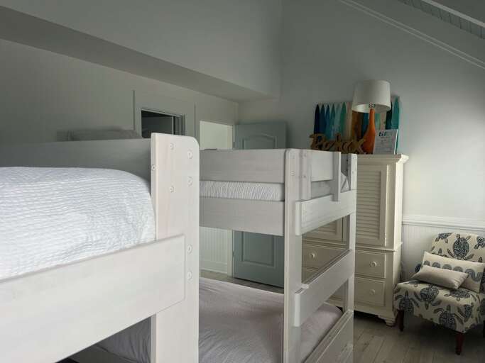 Interior With Bunk Beds And Armchair