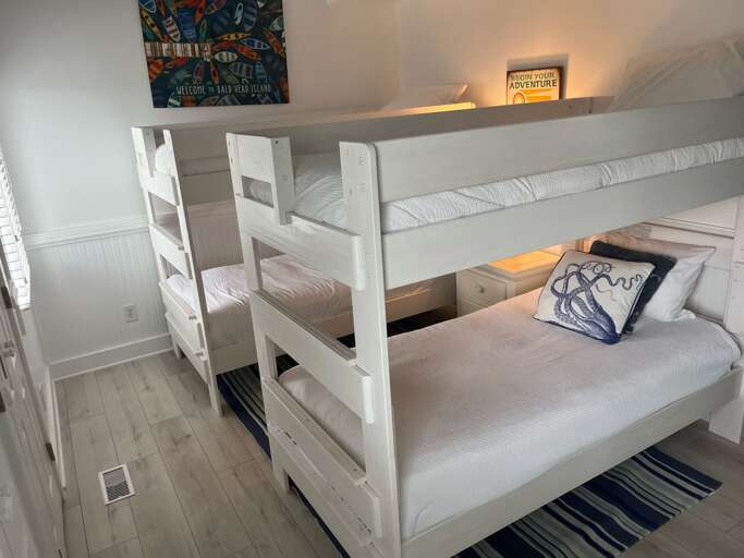 White Bunk Beds In A Simple Room