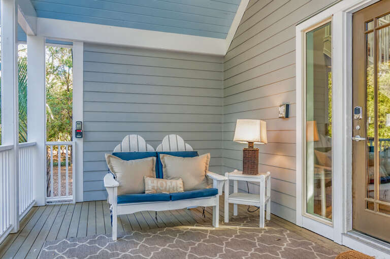 Serene Seating Setup On Sunny Vacation Rental Veranda