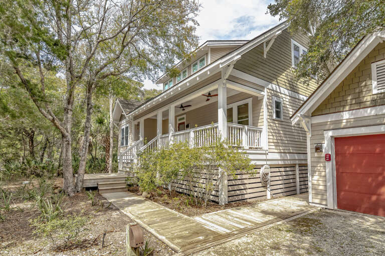 Beige Building Bordered By Bare Branches