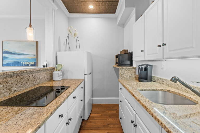 Vacation Rental View: Pristine Kitchenette, Granite Counters, Gleaming Gadgets