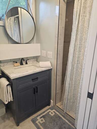Small Bathroom With Sink And Shower Curtain
