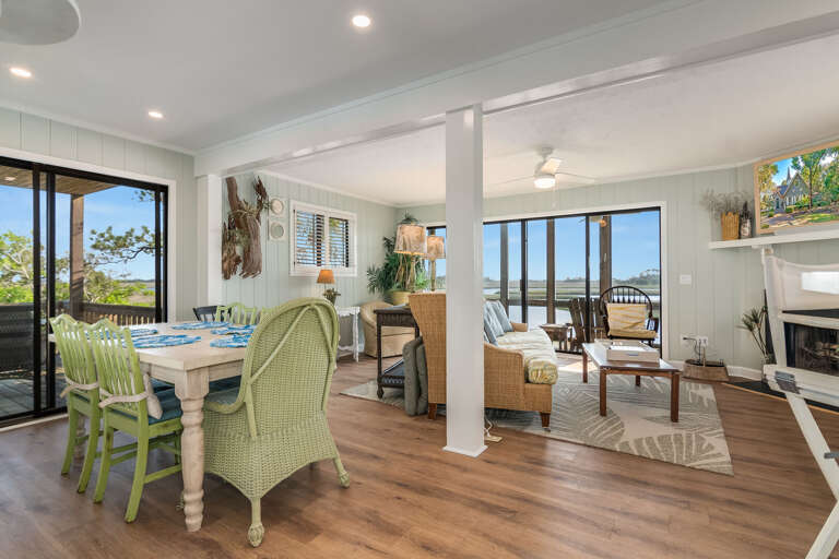 Bright Beachside Living Space With Scenic Sea Views, Vibrant Furnishings, Flowing Into A Breezy Balcony