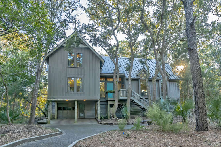 Green-gray Structure Surrounded By Serene Shade Trees