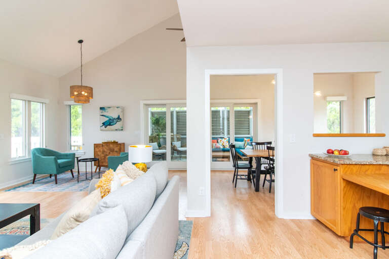 Bright, Breezy Living Space With Open Layout, Wooden Floors, Spacious Seating, Large Windows