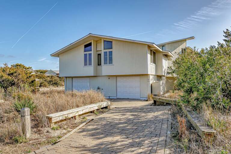 Seaside Structure Surrounded By Sand And Shrubbery, Spacious Vacation Rental