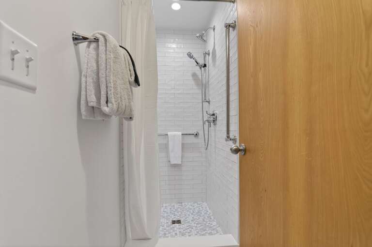 Tiled Shower With Towel On Rack