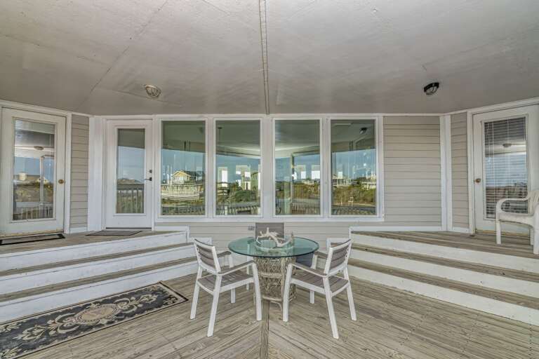 Spacious Sunlit Space With Sprawling Steps And Seating, Surrounded By Sweeping Windows