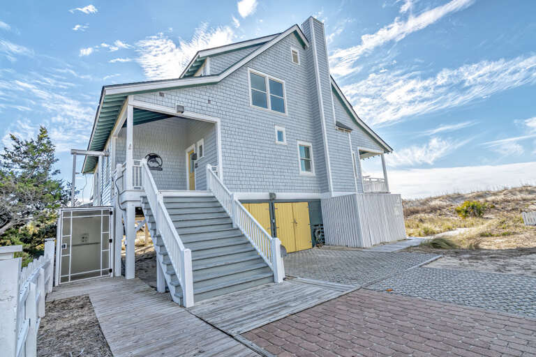 White Wooden Building With Blue Sky Background