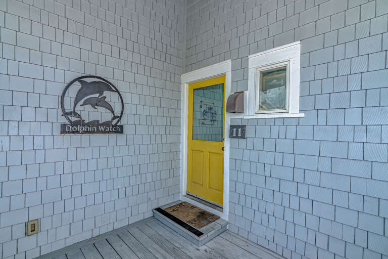 Light Blue Bricks Border Bright Yellow Door