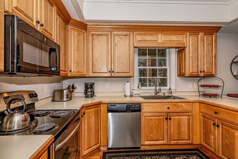 Kitchen Corner, Wooden Cabinets, Clean Counters, Window View