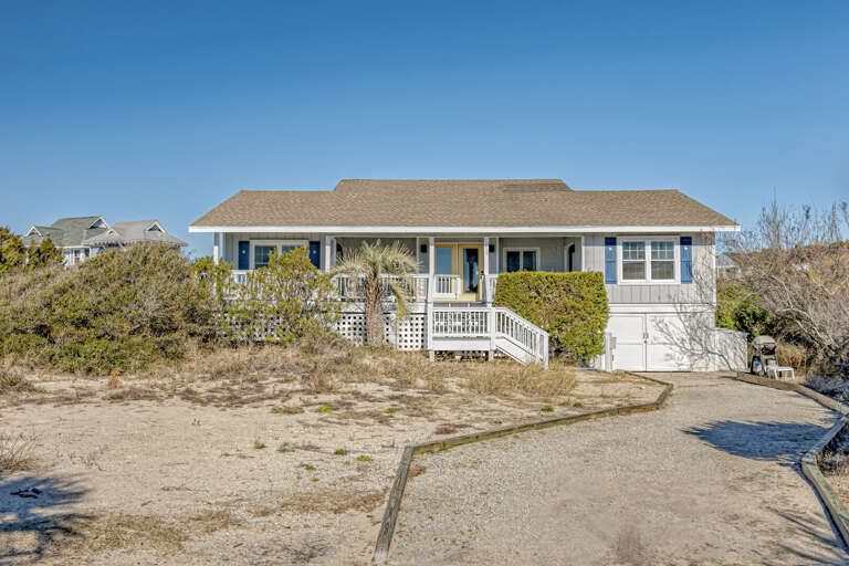 Beachside Bungalow Bordered By Dunes