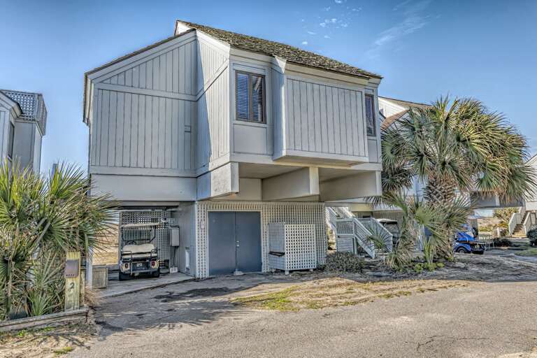 Vacation Rental: Two-story Structure Surrounded By Palms
