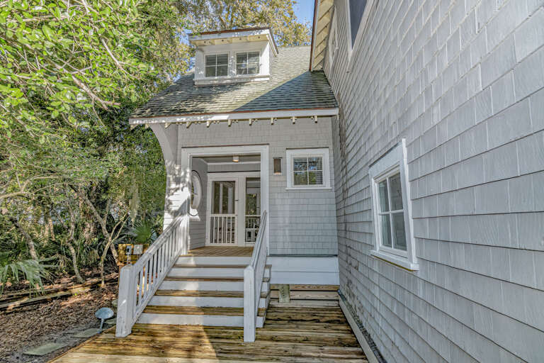Vacation Rental With Verdant Views And Vibrant Light, Showcasing Serene Side Entrance