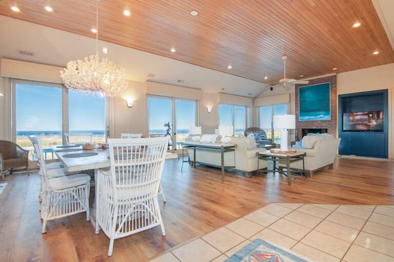 Bright Beachfront Vacation Rental Interior Showcasing Spacious Seaside Seating Bright Beachfront Vacation Rental Interior Showcasing Spacious Seaside Seating