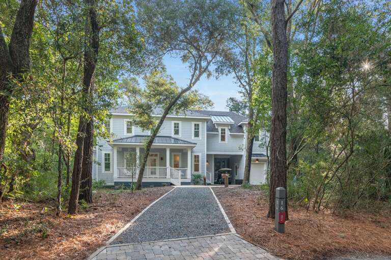 Tree-lined Trail To Two-story Residence, Flanked By Foliage