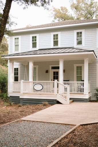 White Wood-paneled Vacation Rental Nestled Among Nature
