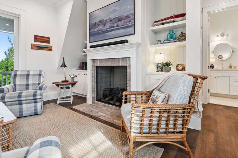 Living Room With Fireplace And Wicker Furniture
